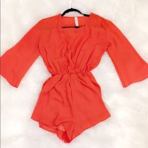 Long sleeve orange romper (deep v neck)